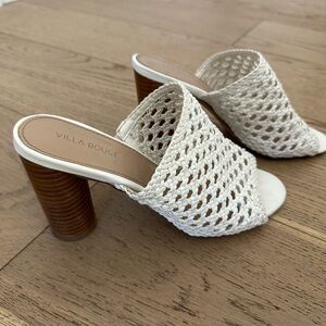 White heeled sandals with laser cut out design